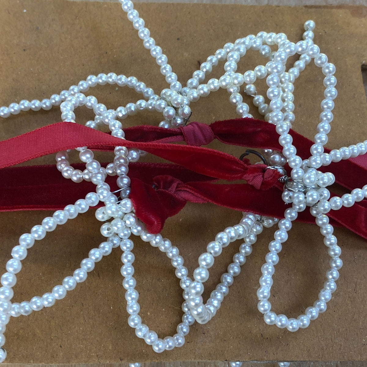 Elegant Pearl Bow Christmas Garland Red Ribbon
